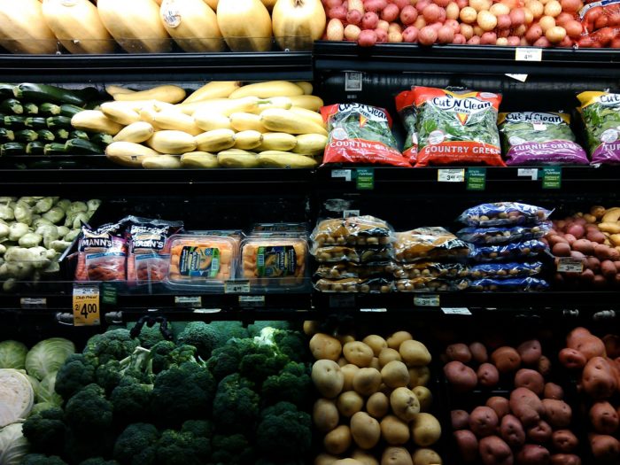 refrigerated produce aisle in grocery store
